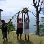 Here Helen Limed, Numie Acker and Michael Ranganbay work on the wedding arch.